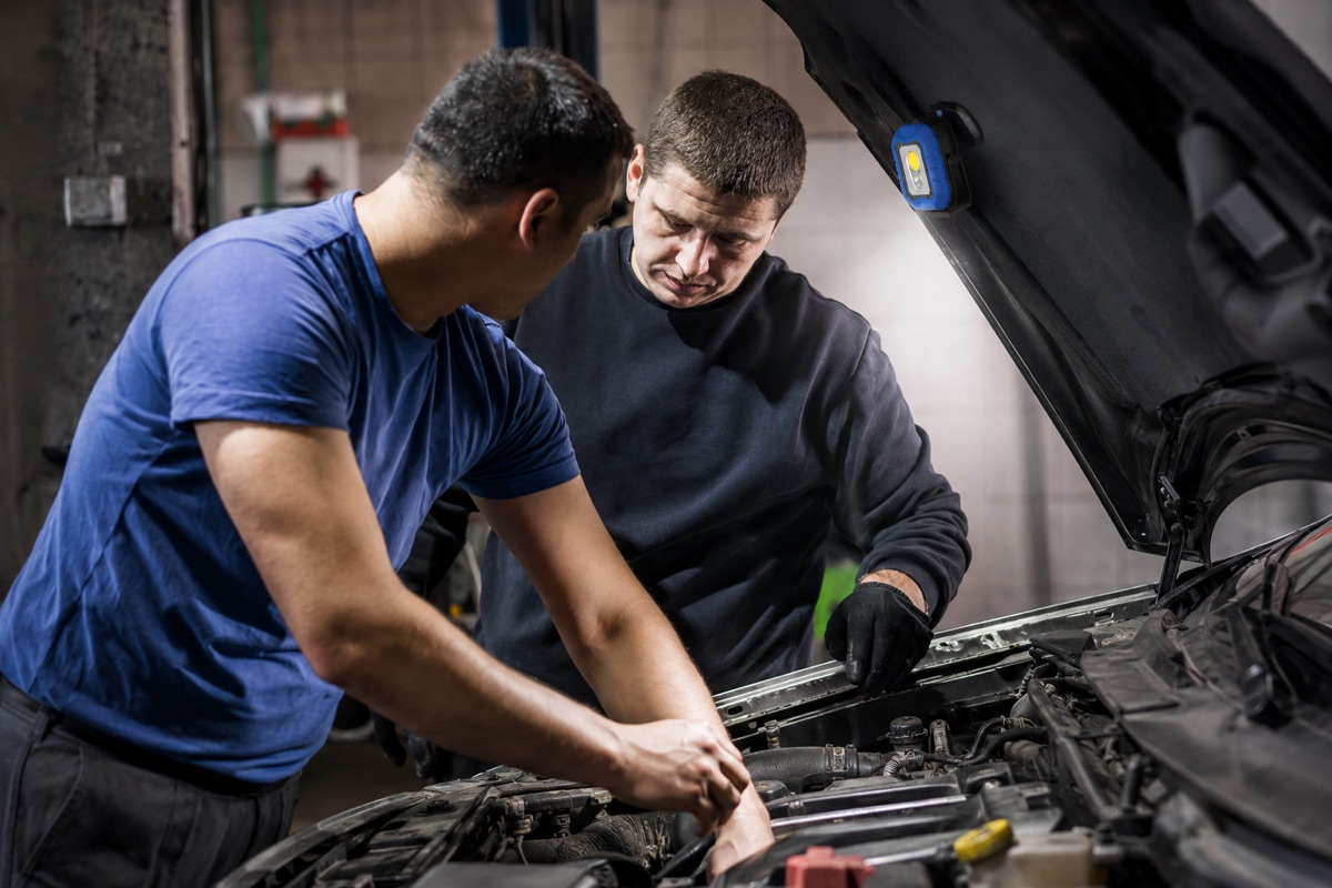 WT-9105 rechargeable work light mounted under a vehicle hood during auto repair